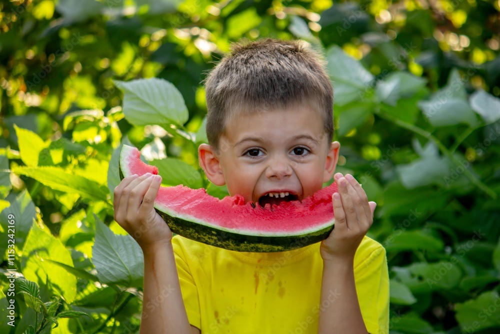 The child eats watermelon in the summer. Selective focus The child eats watermelon in the summer. Selective focus