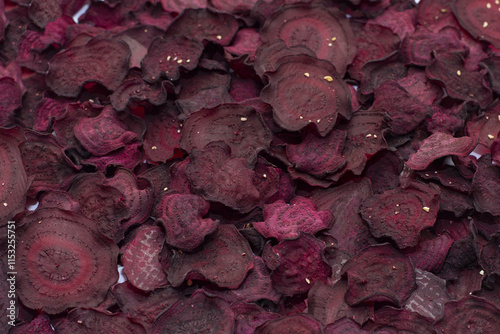 Beet vegetable chips, vegetable background, dried beetroot slices, frips, beet slices, selective focus