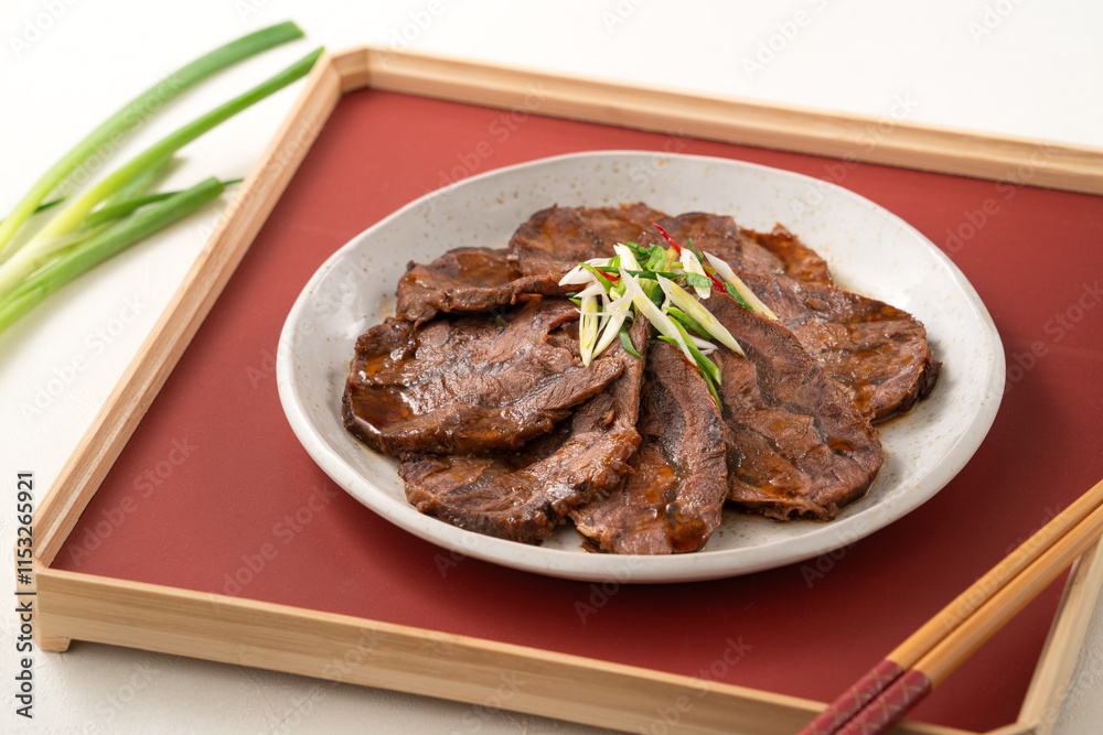 Taiwanese braised beef shank slices in a plate on white table background. Taiwanese braised beef shank slices in a plate on white table background.