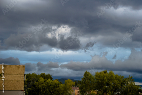 Storm clouds over the city, dramatic sky, stormy weather.