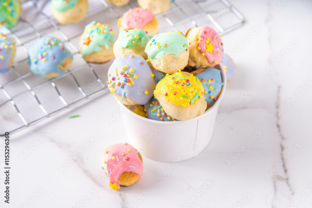Fototapeta premium Sweet colorful glazed donuts holes dessert