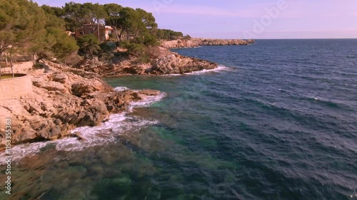 Experience the beauty of Cala Rajada in Mallorca with picturesque rocky shores and clear, inviting waters. This coastal area offers a serene escape, perfect for beach lovers and adventurers.