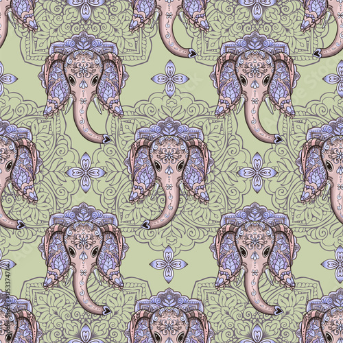 Elephant head Indian style ethnic seamless pattern design with ornamental mandala background photo