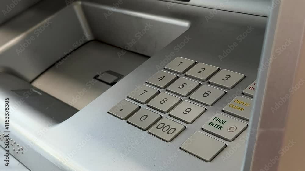 Entering ATM cash machine PIN code, close-up Entering ATM cash machine PIN code, close-up