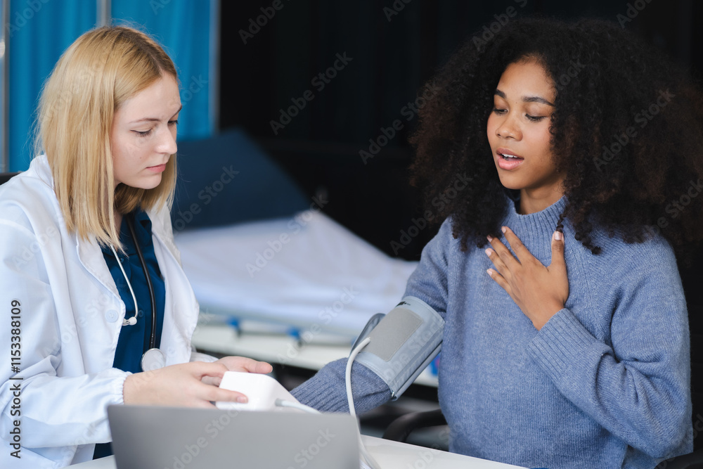 doctor checking woman blood pressure at clinic and filling patient history in the morning. doctor checking woman blood pressure at clinic and filling patient history in the morning.
