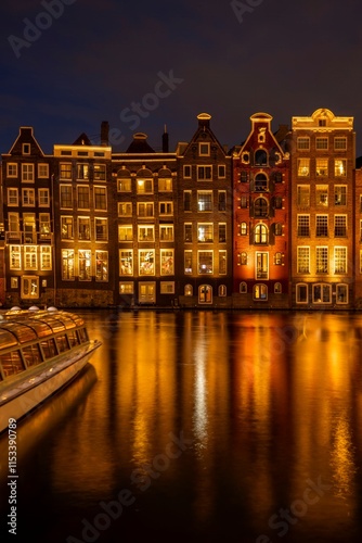 Photography Panoramic view of facades of colorful illuminated Amsterdam houses reflecting in