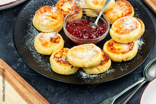 Cottage cheese pancakes or curd fritters stack. photo