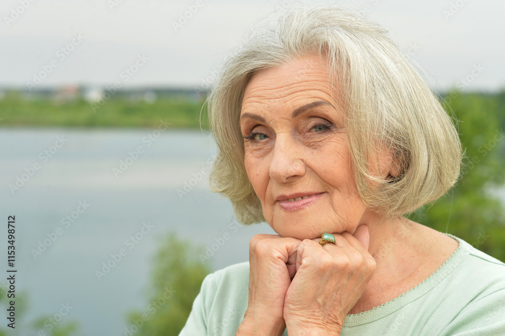 Portrait of a beautiful elderly woman in the park Portrait of a beautiful elderly woman in the park