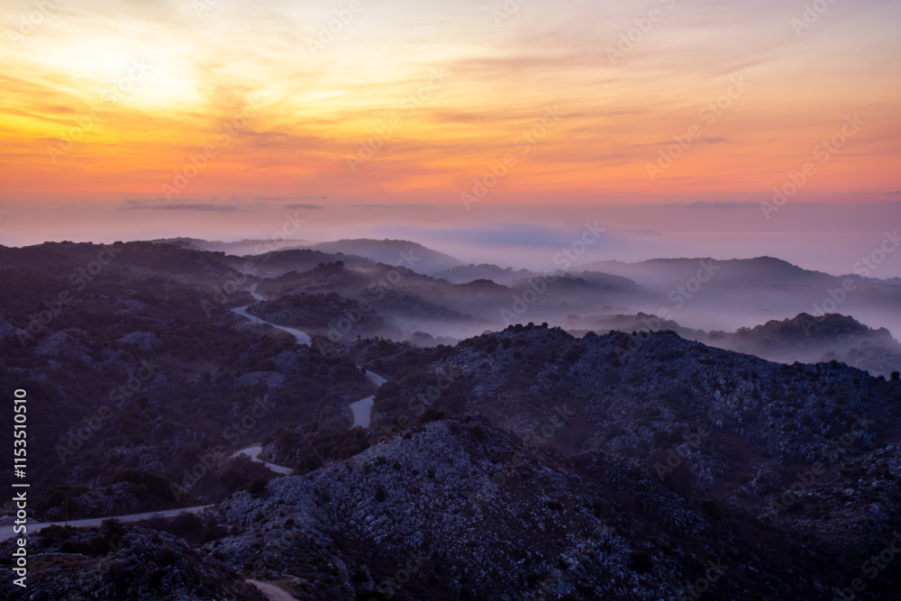 Sunrise paints the misty mountain roads in vibrant hues. Sunrise paints the misty mountain roads in vibrant hues.