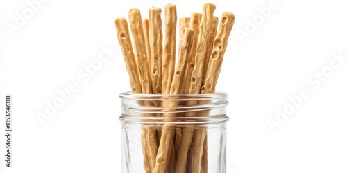 Air corn sticks displayed in a glass jar isolated against a white background, showcasing the unique texture and appeal of air corn sticks in an attractive presentation. photo