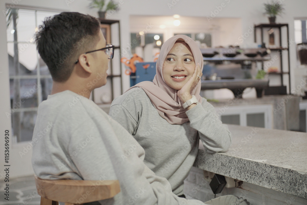 Fototapeta premium romantic muslim husband and wife face to face each other at home
