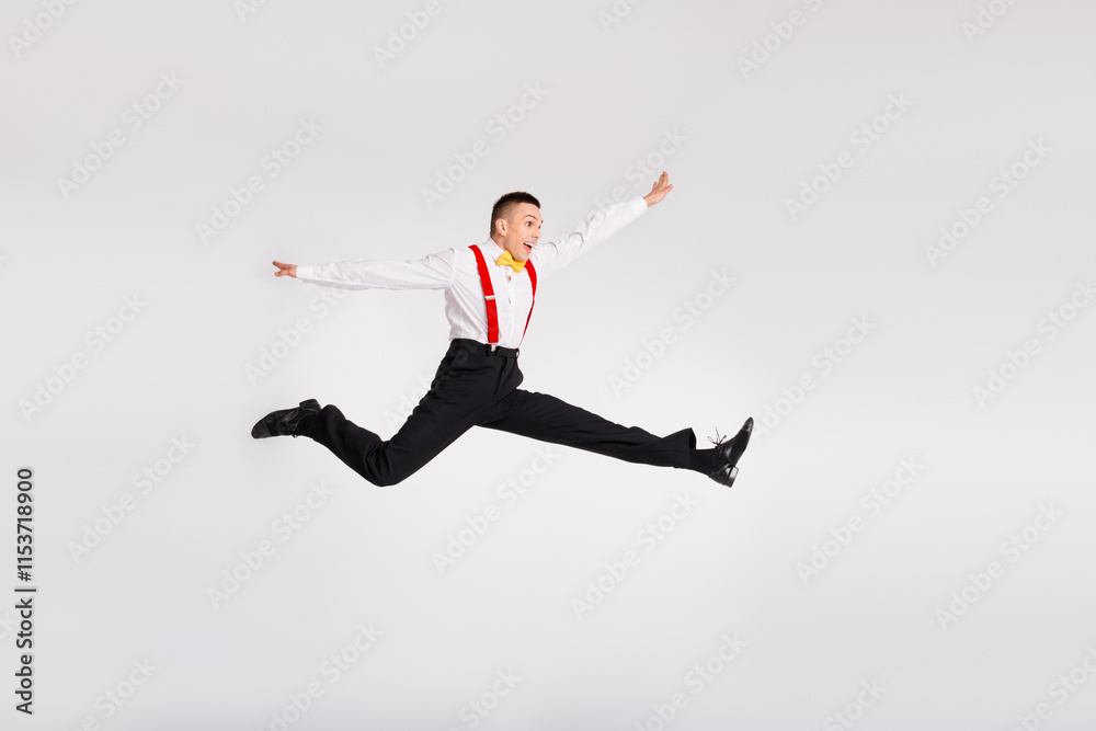 Young male dancer leaping gracefully in mid-air with vibrant energy and style on a white background Young male dancer leaping gracefully in mid-air with vibrant energy and style on a white background