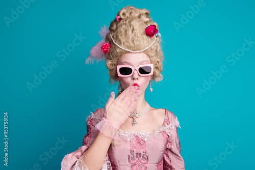 Portrait of medieval princess girl hand cover mouth wear luxury dress isolated on turquoise color background