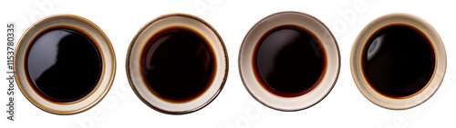 Four small bowls filled with rich, dark soy sauce for cooking and dipping.