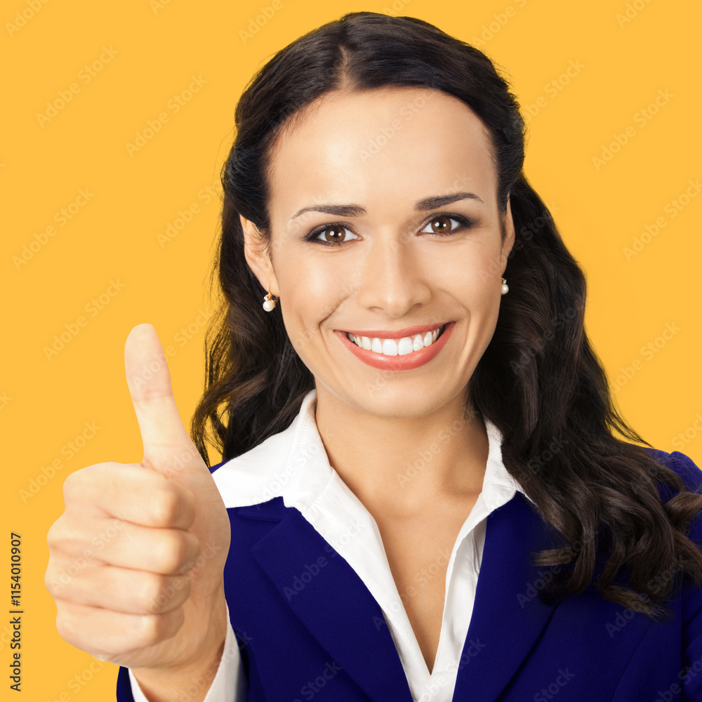 Image - happy smile business woman, office worker, show thumbs up hand sign, isolate orange yellow background. Brunette cute businesswoman, white collar manager making positive success gesture. Square Image - happy smile business woman, office worker, show thumbs up hand sign, isolate orange yellow background. Brunette cute businesswoman, white collar manager making positive success gesture. Square