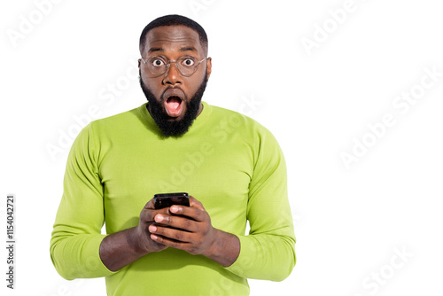 Portrait of impressed person in eyeglasses eyewear holding modern technology screaming unbelievable wearing green sweater isolated over white background photo