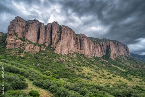 Majestic Mountain Range Under a Dramatic Sky: A Breathtaking Landscape of Nature's Grandeur photo