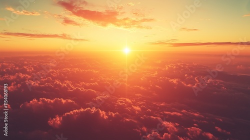 Golden sunset viewed from above sea of clouds bathed in warm light