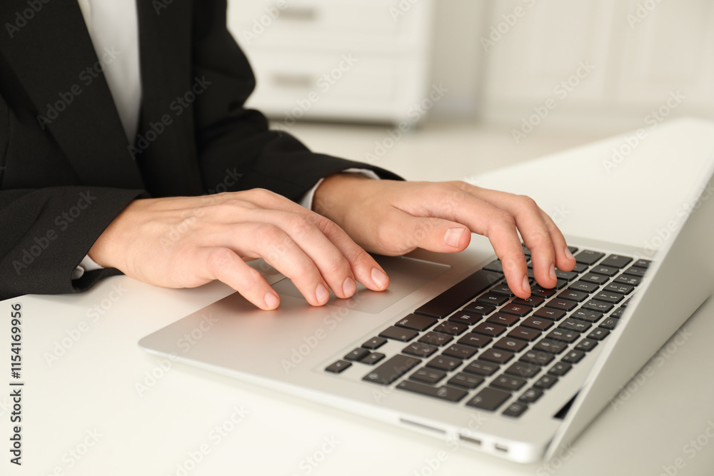 Businesswoman using laptop at white table indoors, closeup. Modern technology Businesswoman using laptop at white table indoors, closeup. Modern technology