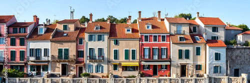 a row of row houses Mediterranean style. Long banner