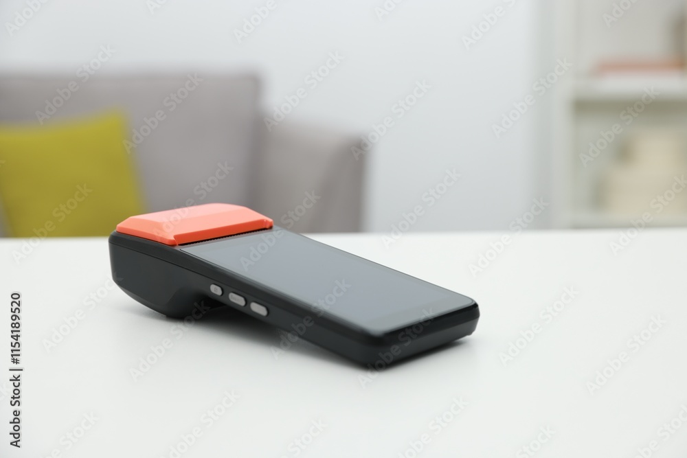 Payment terminal on white table indoors, closeup. Space for text