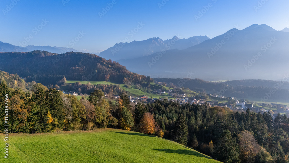 Fototapeta premium The village of Düns in the Walgau Valley, State of Vorarlberg, Austria, Drone Photography