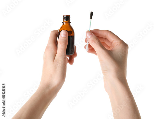 Woman with bottle of topical iodine and cotton swab on white background, closeup