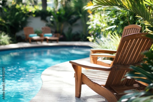 Tranquil Tropical Poolside Scene with Wooden Lounge Chairs Surrounded by Lush Greenery and Bright Sunlight in a Relaxing Outdoor Setting