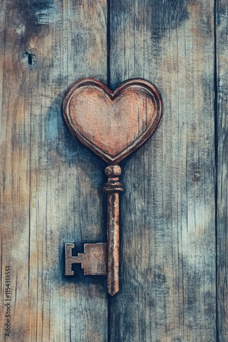 Wallpaper Mural Heart-shaped key elegantly displayed against a textured wooden background. Its rustic design invites curiosity and serves as a versatile decorative piece for various settings Torontodigital.ca