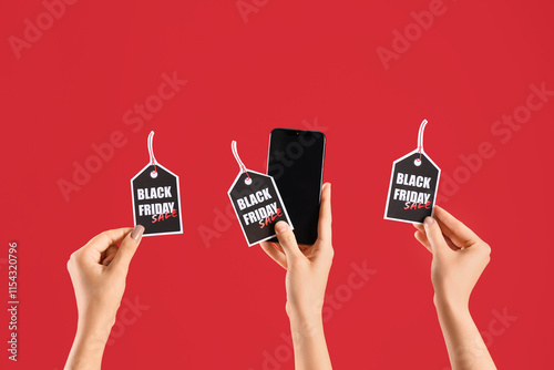 Female hands holding mobile...