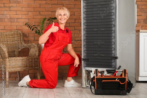 Female worker repairing ref...