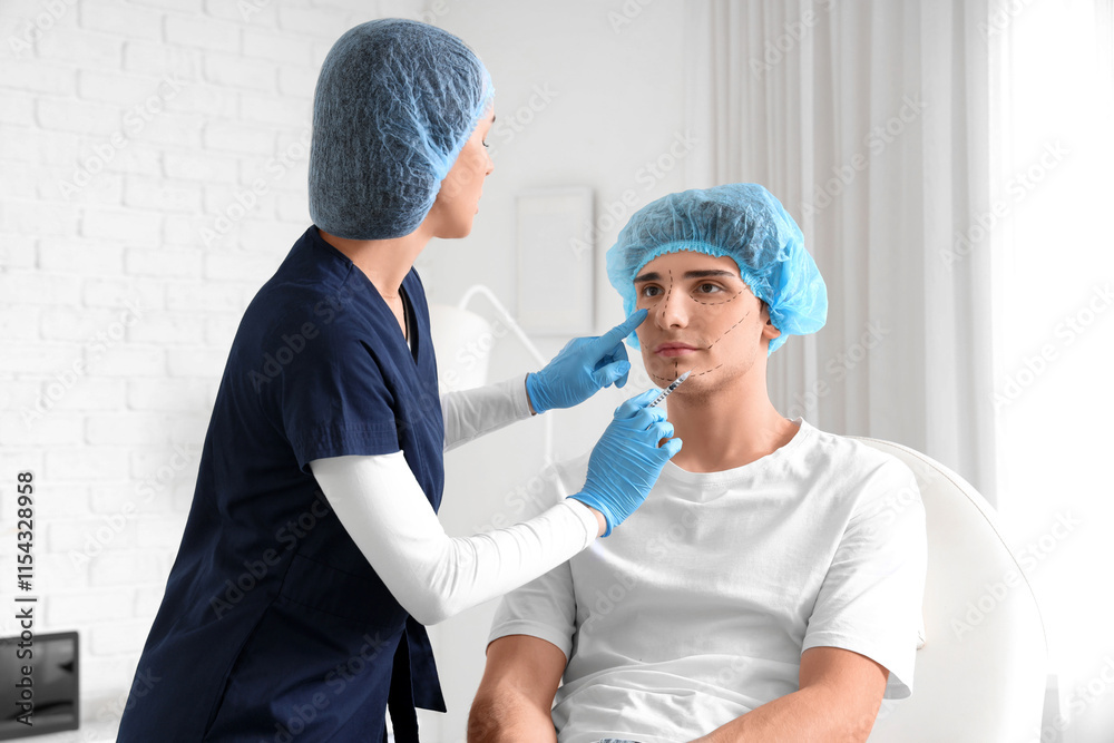 Young man receiving injection from plastic surgeon in clinic Young man receiving injection from plastic surgeon in clinic