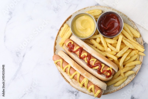 Photography Tasty hot dogs with fries served on white marble table, top view