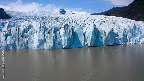 Aerial view of the ice cliffs in the front part of the Fjallsjokull glacier in southeast Iceland.  photo