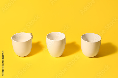 Three empty white ceramic c...
