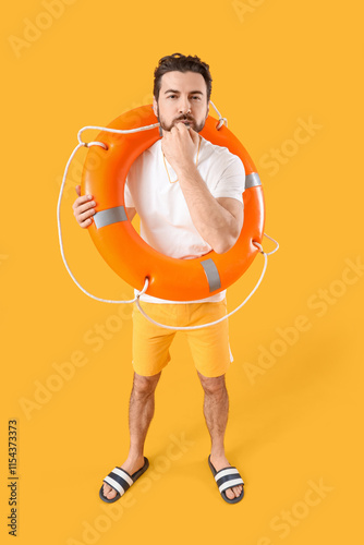 Beach rescuer with lifebuoy...