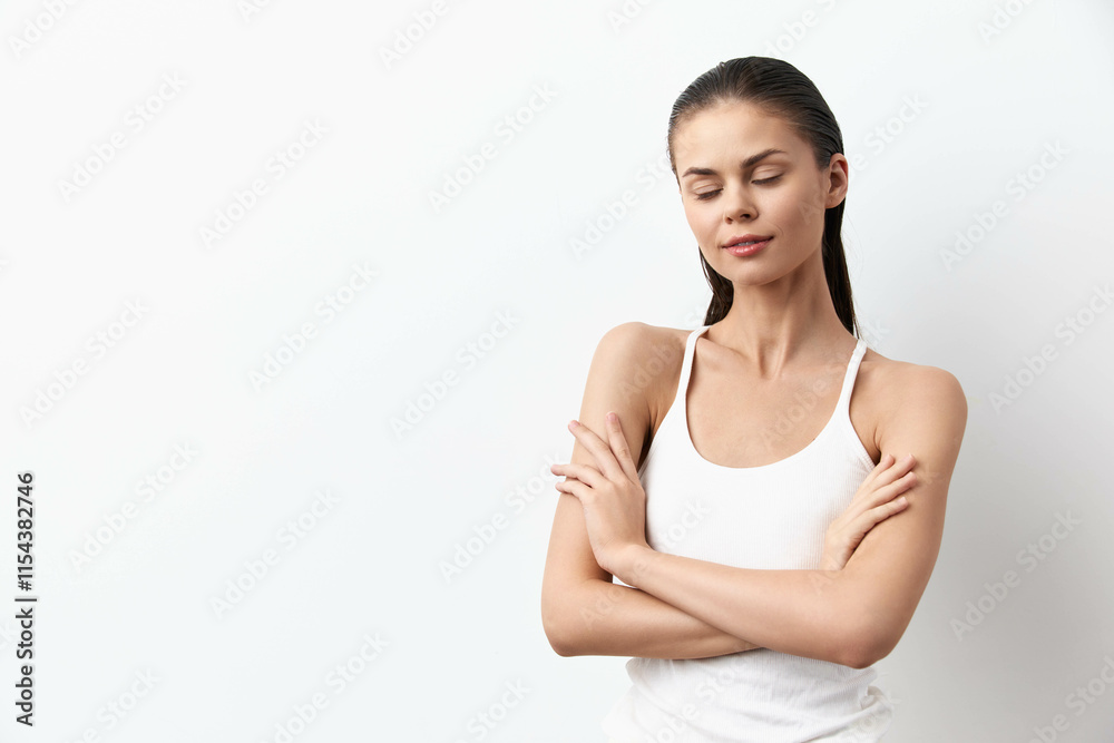 Woman in white T-shirt on white background Woman in white T-shirt on white background