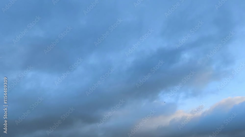 Curious and mysterious sky of blue and bright tones with orange tints at dawn Curious and mysterious sky of blue and bright tones with orange tints at dawn