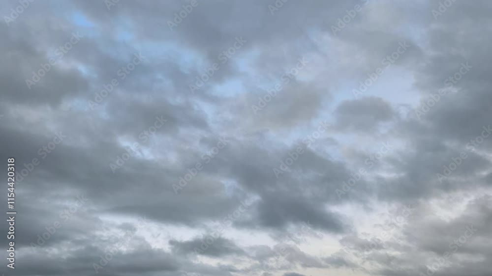 Curious sky landscape with altocumulus clouds moving unite at dawn
