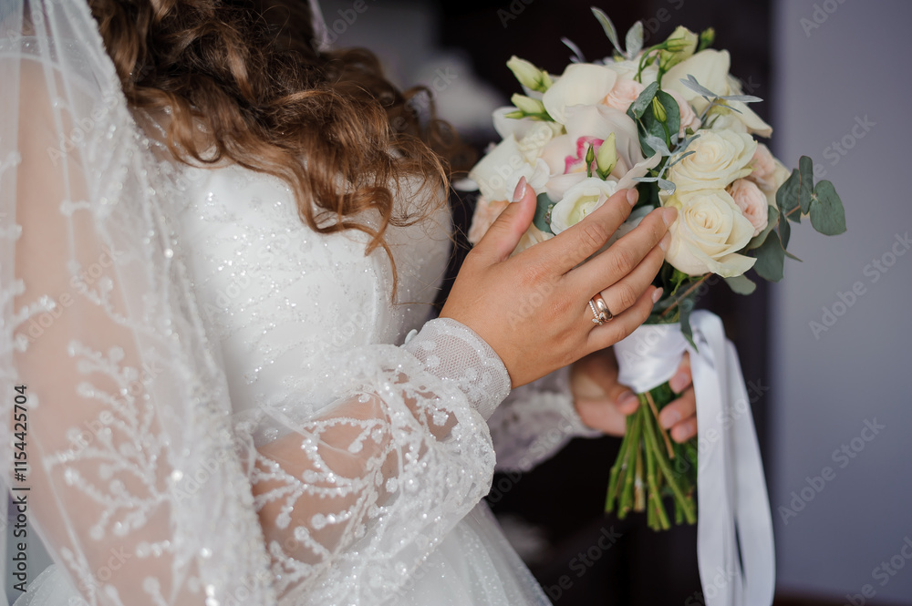 Naklejka premium Elegant Bride Holding a Beautiful Bouquet on Her Wedding Day