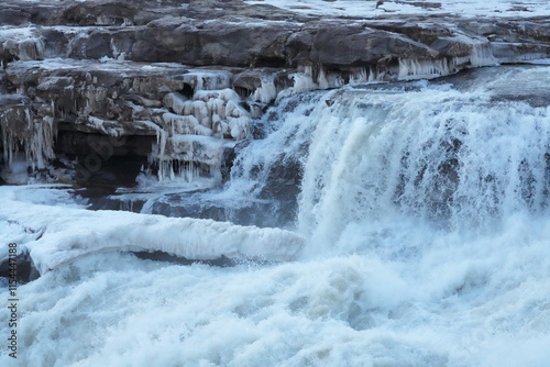In winter, the Yellow River in China freezes over, thundering through the gorge as chunks of ice hang and dangle dramatically from its banks.
