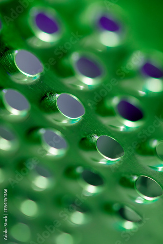 Close Up of a Steel Metal Perferated Hole Background Abstract Futeristic Circles photo