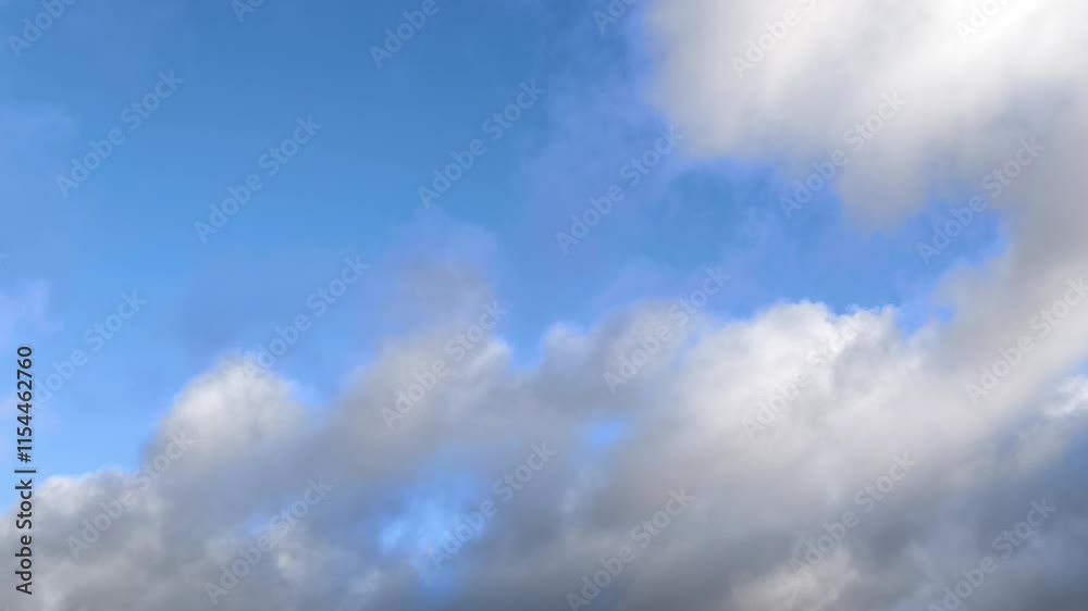Altocumulus clouds moving across the sky as they transform into cumulus at dawn Altocumulus clouds moving across the sky as they transform into cumulus at dawn