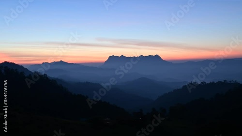 Hadubi Camping Viewpoint, view of Doi Luang Chiang Dao mountain in the morning with thick fog. with celosia cristata Asian cockbomb flower Wiang Haeng District, Chiang Mai, Thailand. photo