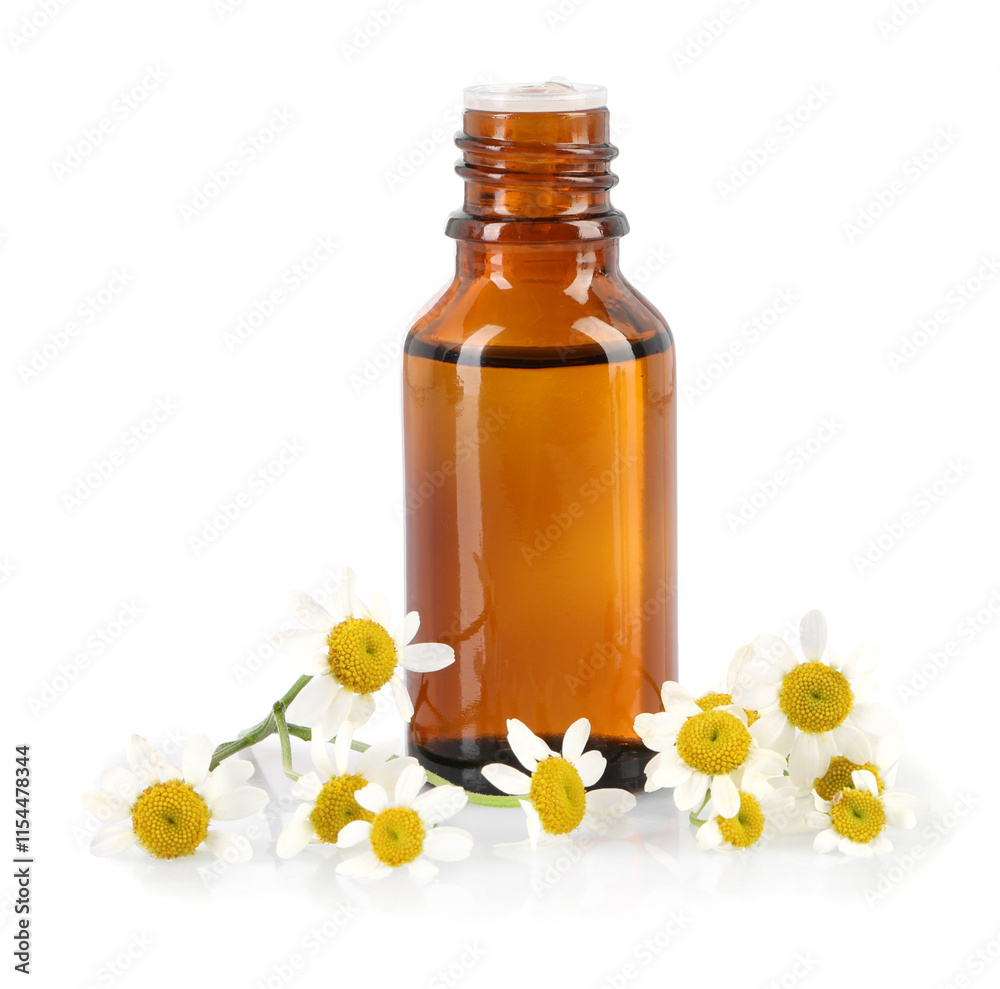 Bottle of essential oil and chamomile flowers isolated on white Bottle of essential oil and chamomile flowers isolated on white