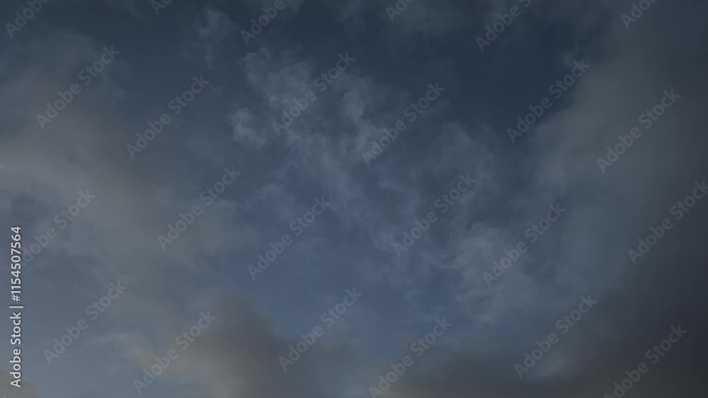 Clouds moving across the sky at dawn with the crescent moon in the background Clouds moving across the sky at dawn with the crescent moon in the background