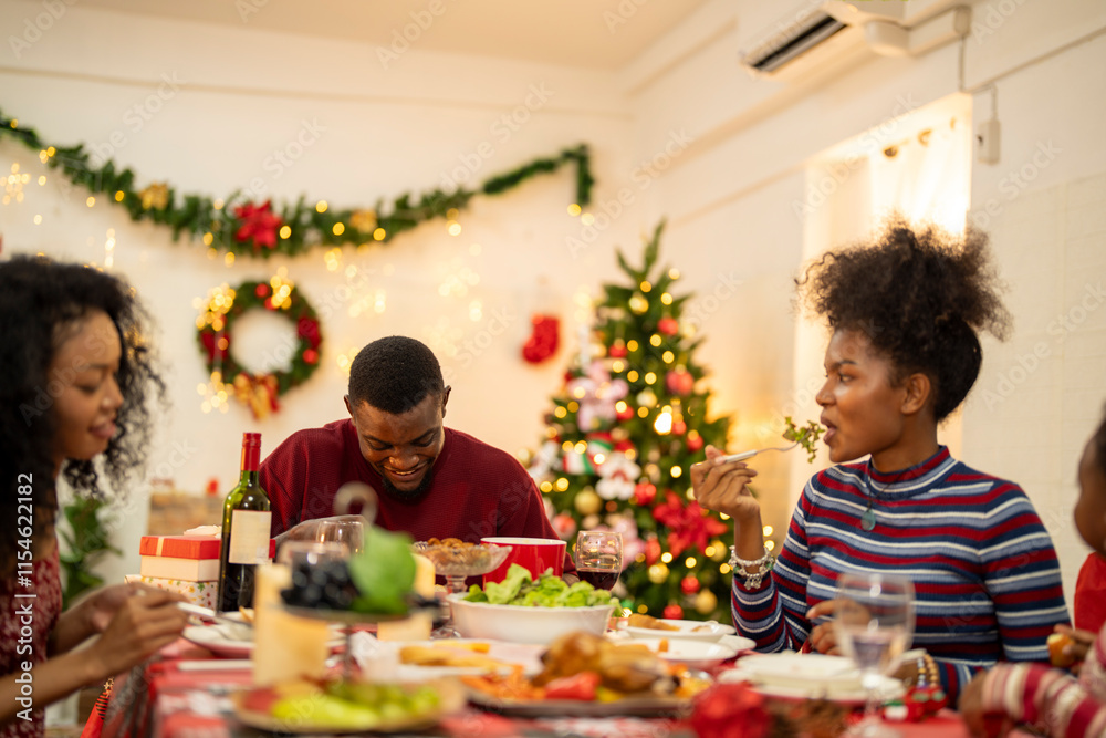 A festive family Christmas dinner setting with a decorated tree in the background. The family gathers around a beautifully decorated table, sharing food, joy, and warmth in the holiday spirit. A festive family Christmas dinner setting with a decorated tree in the background. The family gathers around a beautifully decorated table, sharing food, joy, and warmth in the holiday spirit.