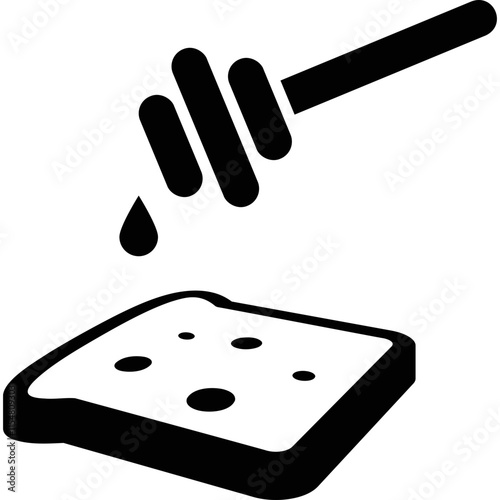Honey Dripping onto Toast from Honey Dipper