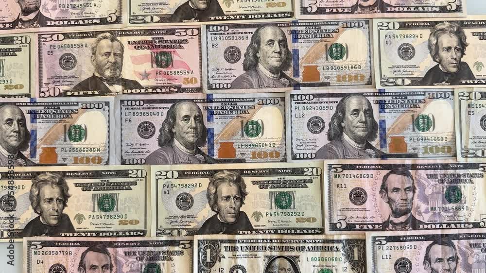 Footage from above of dollar money, several banknotes