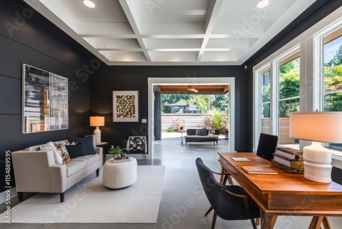 Modern home office with coffered ceiling, neutral decor, and patio access.